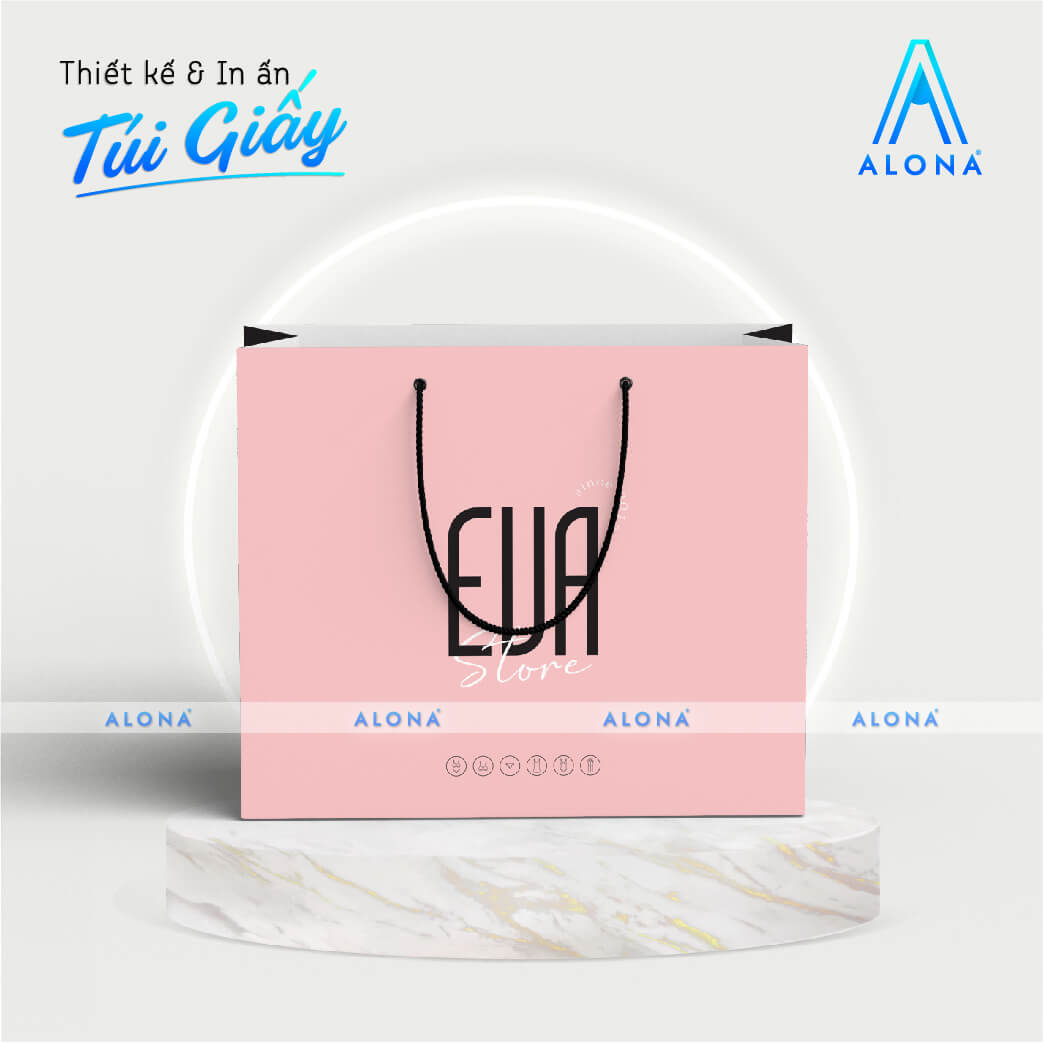 Túi giấy màu hồng phấn, dây quai đen dạng xoắn hiện đại và đơn giản